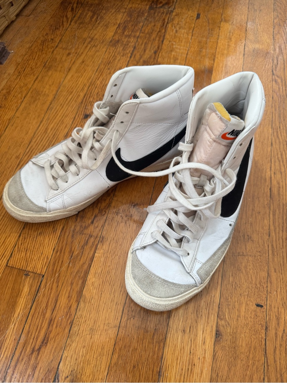 Nike men’s White High-Top Sneakers with Black Swoosh